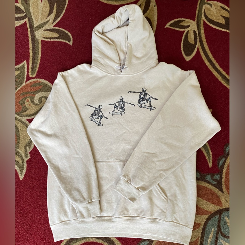 White Hoodie With Skateboarding Skeletons